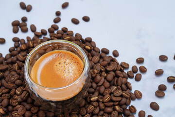 Background Espresso in a cup of coffee and beans Caffeine drink tastes good.