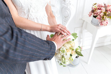 wedding bouquet in hands of the bride