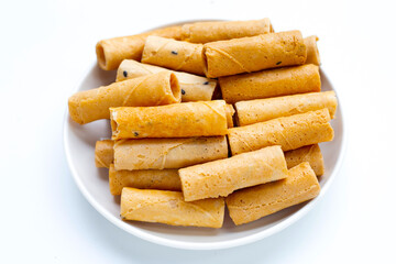Thai crispy coconut rolls on white