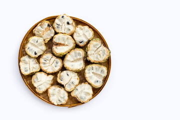Custard apple in bamboo basket on white background.