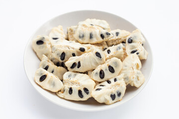 Custard apple in white plate on white background.