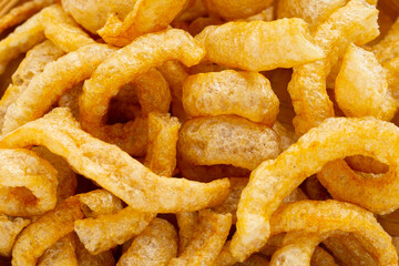 Fried crispy pork rinds. Close up