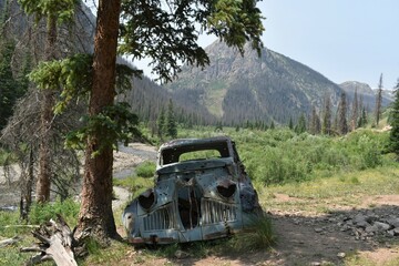 old abandoned car in the mountains