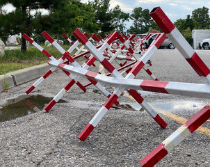 Hedgehog Roadblocks. The Czech hedgehog on the road. White and red