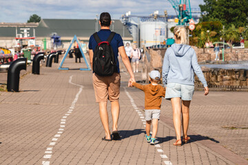 family walking along the promenade
