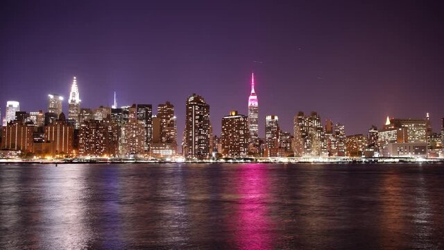 night view on manhattan and pink light empire state building 4k timelapse from new york