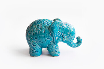 Decorative turquoise elephant on white background