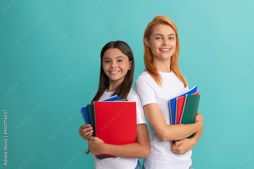 Wall mural private teacher and child holding copybooks. family help. mother and daughter hold notebook