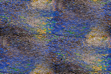 Seamless mosaic texture made of colored stones.