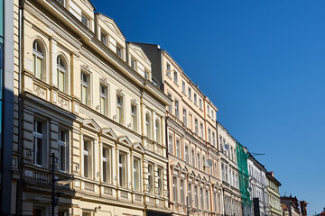 Fototapeta na wymiar street with facades of historic tenement houses