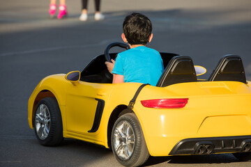 baby boy driving car toy