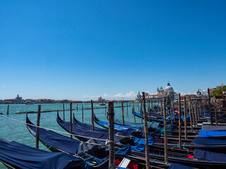 Fototapeta na wymiar Gondolas moored in a Venice canal
