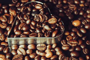 coffee bean on a black wooden table with copy space or drinks menu. top view. Concept of love for coffee.