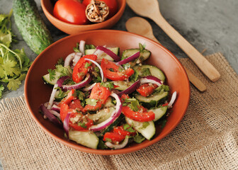 Fresh salad with tomatoes and cucumbers.
