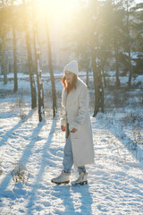 HAppy jumping woman has fun in forest in snowy weather. Winter holidays concept. Winter 2022.