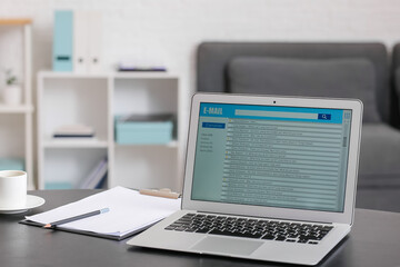 Laptop with open e-mail box on table