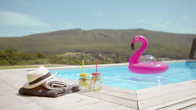 Pink inflatable flamingo floating in the pool.