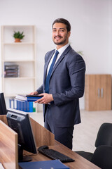 Young male employee working in the office