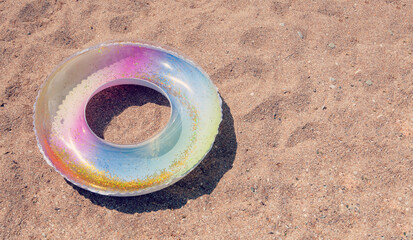 Swimming Ring. Children Baby Swimming Lap. Inflatable swim ring on sand beach