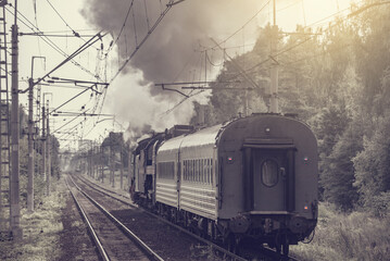 Retro train moves at day time. Moscow region. .
