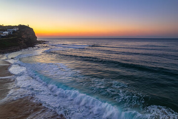 Clear skies aerial sunrise at the beach