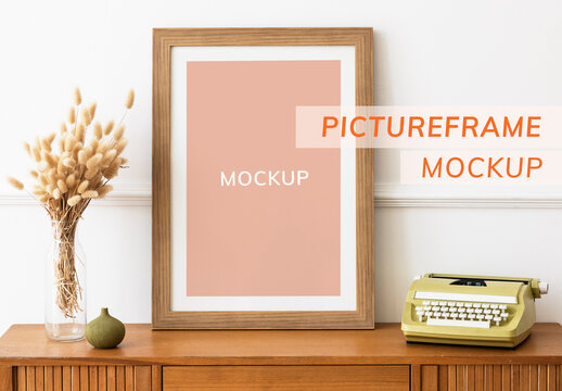 Picture Frame Mockup on a Wooden Sideboard