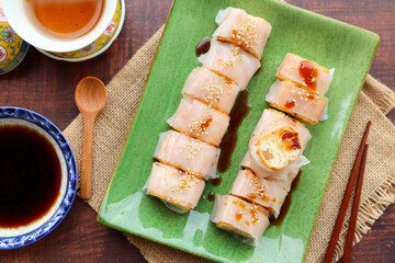 Steamed rice noodles wrapped with Chinese fried dough- Cantonese dim sum called Zhaliang or Cheong...