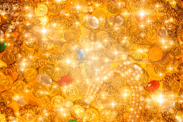 pile of golden coins gems jewel and diamond treasure with blink glitter for background.