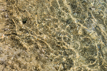 Multicolored pebbles in sea water