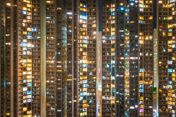Fototapeta na wymiar Exterior of skyscraper apartment in Hong Kong, at night