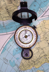 A Compass on map background.