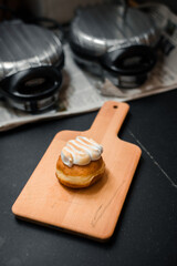 Obraz na płótnie Canvas homemade flavored doughnuts on wooden board