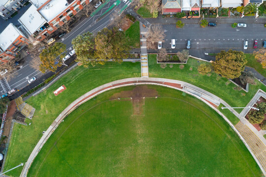 Aerial View Of Suburban Streets Surrounding A Football Oval