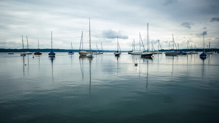 sailing yachts on calm lake, starnberger lake, germany 