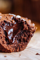 Chocolate lava muffins decorated on wooden background