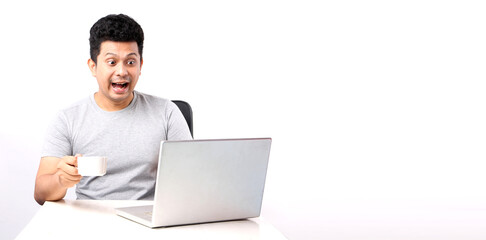 Shocked and Surprised Asian man That has The computer page in front of. on white background in studio With copy space.