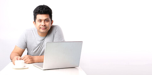 Asian man That has The computer page in front of. on white background in studio With copy space.