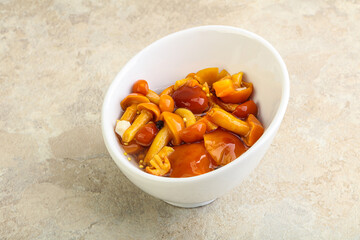 Marinated pickled honey mushrooms in the bowl