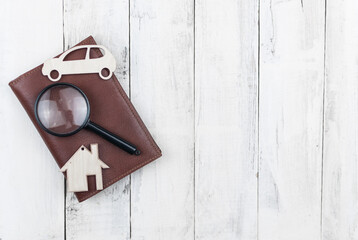 brown leather wallet on wood board background