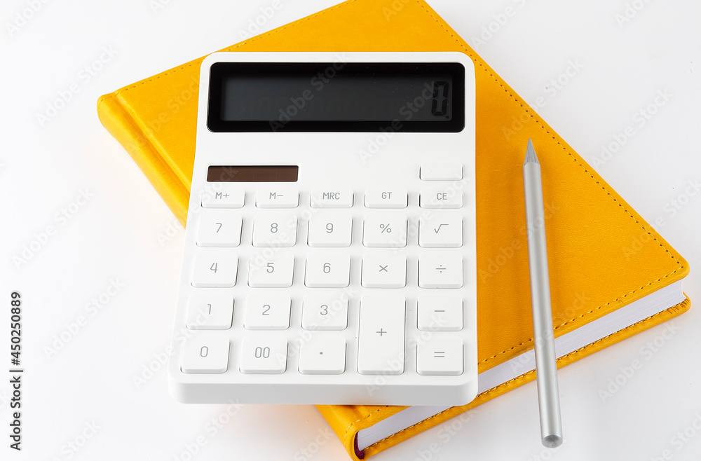 Poster yellow notebook with a pencil and a calculator on a white background