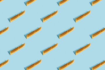 Wooden comb on a blue background. Flat bath accessories. Pattern
