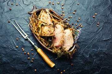 Naklejka premium Baked meat with spicy herbs,space for text