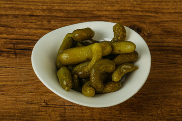 Pickled gherkin in the bowl