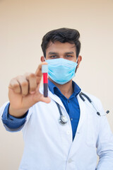 Laboratory assistant analyzing a blood sample