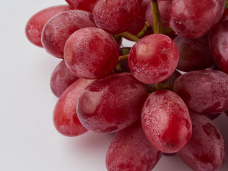Grapes. Red grape. Grape branch isolated on white. With clipping path. Full depth of field.