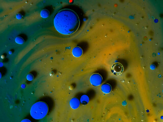 Colorful orange and blue bubbles wallpaper theme background. The concept of a multicolored cosmic universe. Fantastic hypnotic surface. Abstract pattern Chemical Reaction Texture Liquid paint Bubble m
