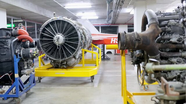 Aircraft maintenance and repair concept. Aircraft turbo engine on display in aircraft maintenance hanger or workshop for studying and training.