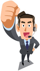 ガッツポーズするヘッドセットを装着したスーツ着用の男性
