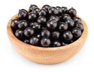 black currant in wooden bowl isolated on white background. macro. clipping path