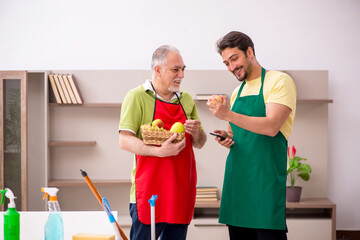 Two male contractors cleaning the house